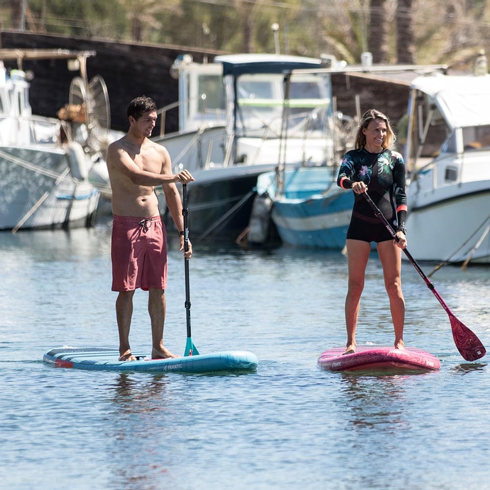 People riding inflatable SUP boards